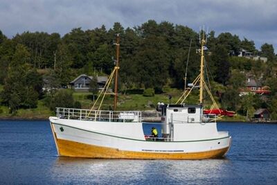 An old wooden boat on the fjord